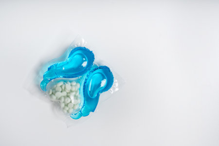 Dishwasher detergent capsules and or laundry soap close-up background.の写真素材