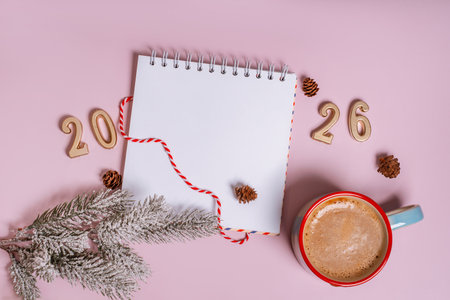 Festive flat lay in a Christmas theme with figures for the year 2026 and decorations and cocoa on an isolated backgroundの写真素材