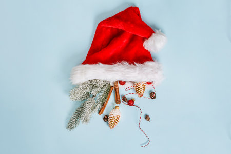 Christmas composition with holiday objects on a blue isolated background. Winter, new year concept. Flat lay, top view, copy space.の写真素材
