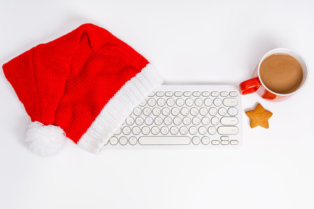 Top above view photo of composition of festive Christmas objects with keyboard laying isolated white background. New Year Christmas composition. Flat lay top view copy space Winter New Year. Office styleの写真素材