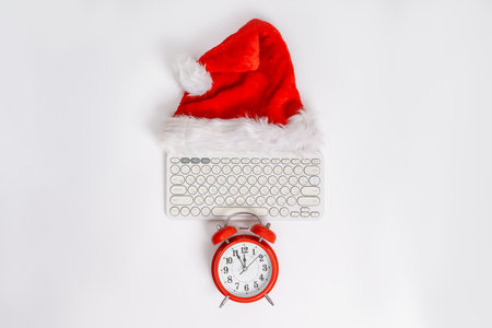 Top above view photo of composition of festive Christmas objects with keyboard laying isolated white background. New Year Christmas composition. Flat lay top view copy space Winter New Year. Office styleの写真素材