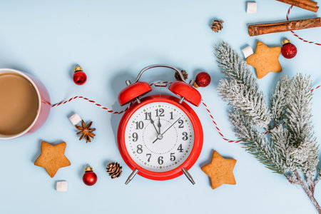 Christmas and New Year holiday composition. Flat lay with blank copy space. An alarm clock with decorations on an isolated background. Top view festive concept.の写真素材