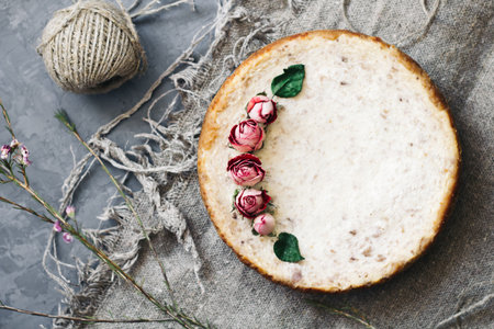 Pie from cottage cheese and bananas. Freshly baked cheesecake on rustic background. Decoration of...
