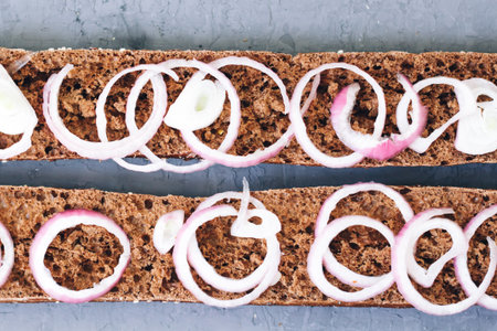 warm, freshly rye baked bread on a rustic background. Cut the slices. healthy eating concept. French...