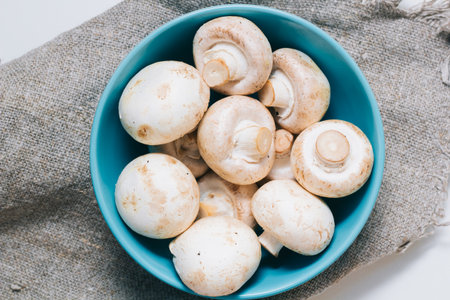 Fresh mushrooms. Raw vegetable. natural plant leaf. healthy and vegetarian or organic bio food. top view. close upの写真素材