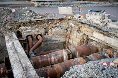 Underground utilities. Modernization, laying or replacement of old pipes. Repair work of water main. Department of housing and communal services.の写真素材