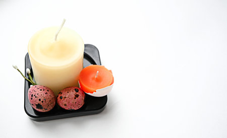 Easter composition with candles of different sizesの写真素材