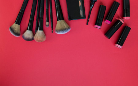 bright eyeshadow palette. a varied color palette of bright shades of shadows on a red background. advertisements for eyeshadow and lipstick. for a blog about cosmetics. The beauty. lipsticks of pink sの写真素材