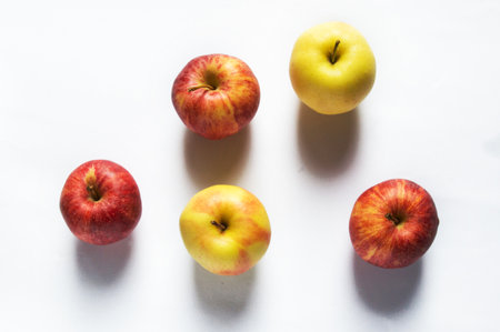 Healthy food concept - fresh fruits and apples and weight loss on a white background. Calorie...