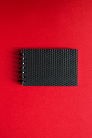 Blanket on a red background. records and business documents, transactions and isolated. space for text, top view and flat lay.の写真素材