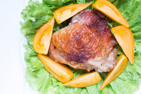 Useful chicken meat with tomatoes and greensの写真素材