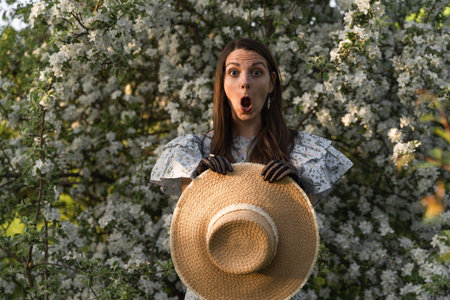 Portrait of young caucasian shocked afraid woman looking with staring eyes, having wide open mouth.
