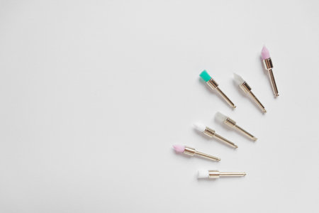 Metal nozzles with multicolored brushes for professional teeth cleaning of dogs and cats. isolated...