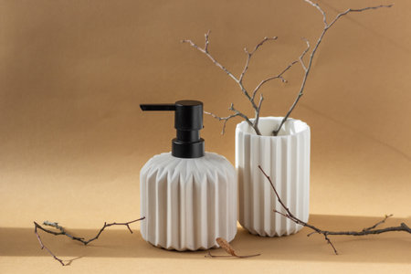 Ceramic pump dispenser bottle of natural hand soap and glass for toothbrushes with fluted surface on...