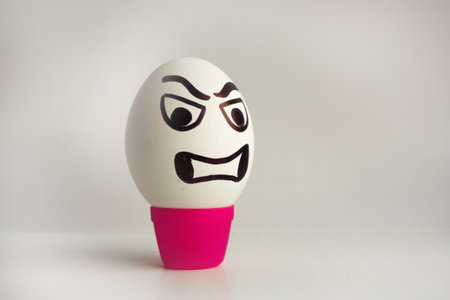 Eggs emotion concept. Clenched teeth. Angry and annoyed. Photo for your design