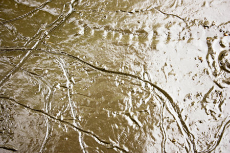 mud. The dirt in the mud after the rain bursts from the head. Photo for your design. Brown and sticky liquidの写真素材
