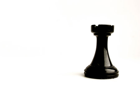 chessmen. Concept of business game. Rook black on white background. Photo for your designの写真素材