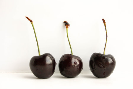 Cherry dark on white background. Photo for your designの写真素材
