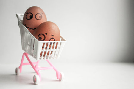 Shopping basket concept. Funny egg with a sketched face. Photo for your design