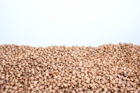 buckwheat. Cereals brown on white background. Photo for your designの写真素材