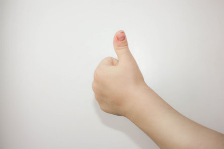 Thumb up hand. Child. all is well. Photo for your designの写真素材