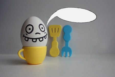 Eggs with face. Concept of a freak in the kitchen. Photo for your design