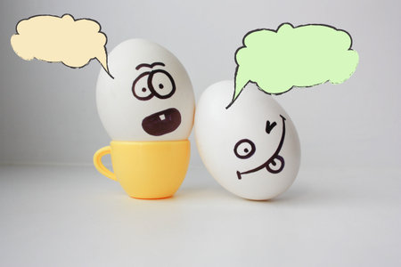 exam. Concept examination. Eggs with painted face. Photo for design. Cloud of thought is white....
