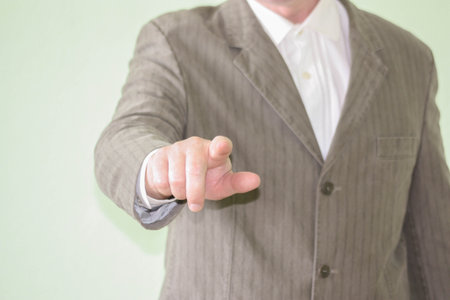 Business concept of achieving the goal. The man is pointing his finger forward. Photo for your designの写真素材