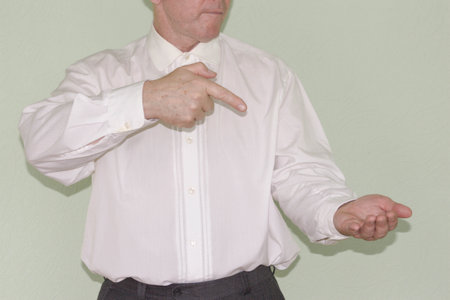 Business concept. The man points a finger at his hand. Photo for your designの写真素材
