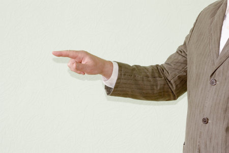 Business concept of the right direction. The man is holding his hand forward, pointing with his finger. Photo for your designの写真素材