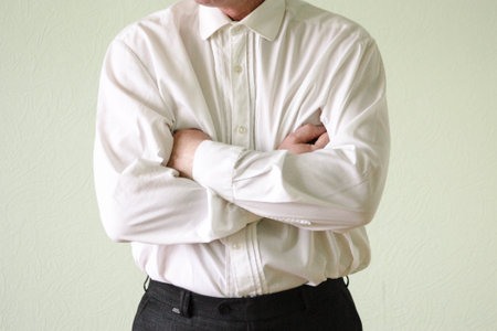 Business concept of rejection. A man in his age is holding his hands together. Photo for your designの写真素材