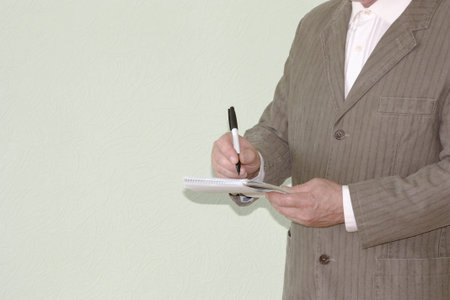 Business concept of the system. Man with a marker and a notepad. Photo for your designの写真素材