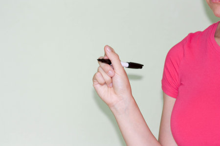 Sales and advertising concept. Place under inscription. Curly girl in red. Photo for your design. Hand profile, markerの写真素材