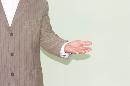 Business training concept. Photo for your design. Hand in profile with palm up. Concentration of moneyの写真素材