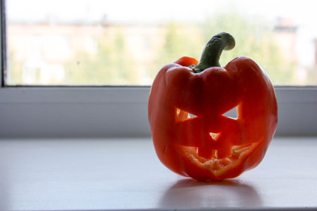 Halloween concept. Pumpkin on white window. Photo for your design.の写真素材