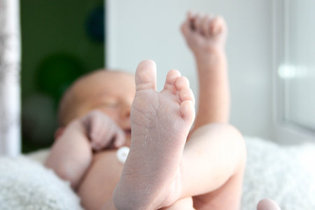 child newborn baby joy. hand up-good luck.の写真素材