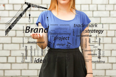 brand concept.photo for your design. girl in blue near a white brick wallの写真素材