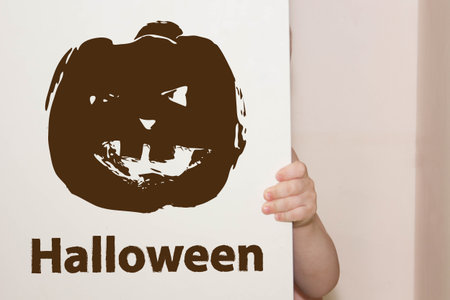 Halloween. dark brown pumpkin funny with Halloween inscription. disfigured horribleの写真素材