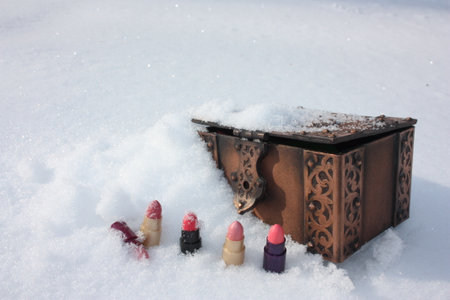 winter catalog cover. a casket and a lipstick in a row. photo for your design.の写真素材