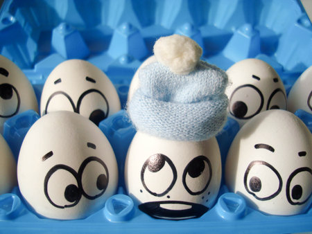 illness winter flu concept. funny eggs in a hatの写真素材