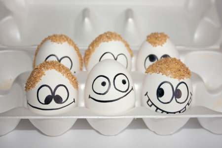 baldness problem concept. the eggs are funny and cute. photo with painted face on the shell. satire...