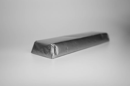 silver bar on a white background. photo for your design. silver or chocolateの写真素材