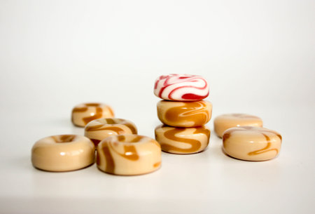 candy caramel sweet milk spiral. photo for your design. dairy and strawberryの写真素材