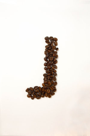 J the letter. alphabet of coffee. coffee beans. concept of healthy eating. photo for your design. vertical orientation of the sheetの写真素材