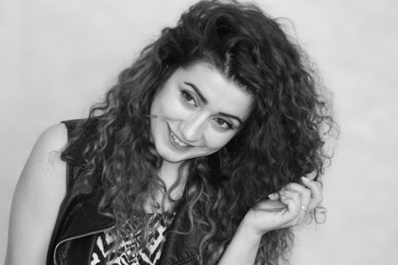 beautiful girl. curly cute girl angry concept photo for your design. black and white photography....