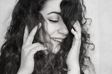 beautiful girl. curly-haired girl. photo for your design. black and white photography. monochrome....