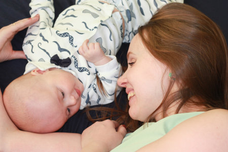 child and mother. healthy and sound sleep. happiness and home. smiles and touches