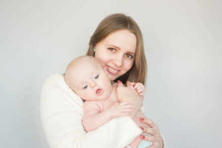 love and family concept. mom and toddler. mom hugs babyの写真素材