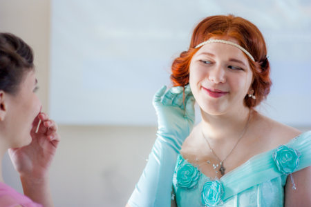 flirting and playfulness. an attractive girl communicates with a girlfriend. red-haired beautyの写真素材