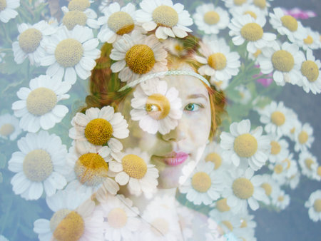 beautiful girl and flowers. red-haired beauty. among white chamomiles